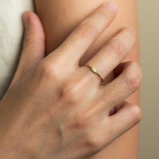Paige Peridot gold ring worn on hand model