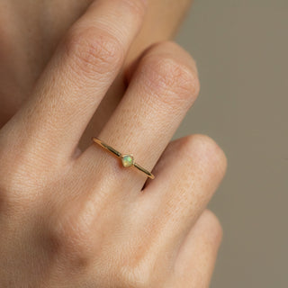 Ali Opal gold ring worn on hand model