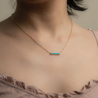 Turquoise gold necklace Kira worn on model
