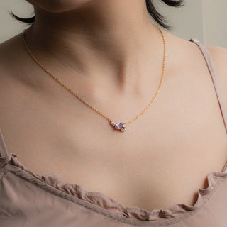 Allison cluster necklace worn on model