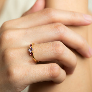 Neve Amethyst and Tourmaline on gold ring worn on hand model